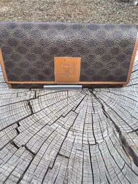 Celine brown leather wallet with kiss lock coin compartment.